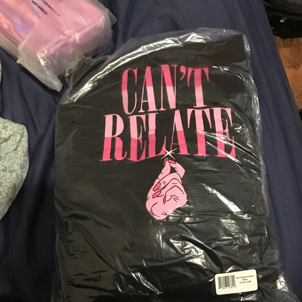 Can’t Relate hoodie and holographic pink JS bag